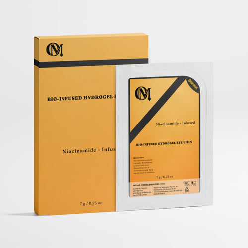 A skincare product package showing a yellow-orange box and a matching single-use eye velly packet with a white backing, both printed with black text and a monogram logo, photographed on a clean light gray background.