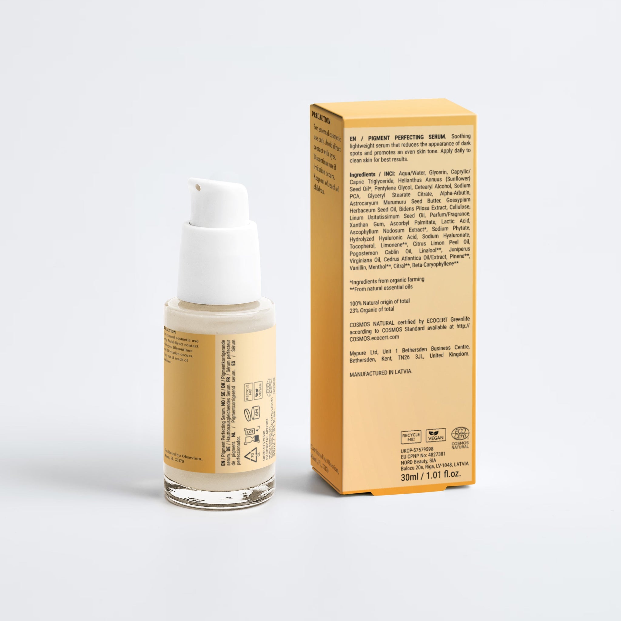 A bottle of liquid foundation with a white pump and a matching beige box, photographed on a clean light gray studio background.