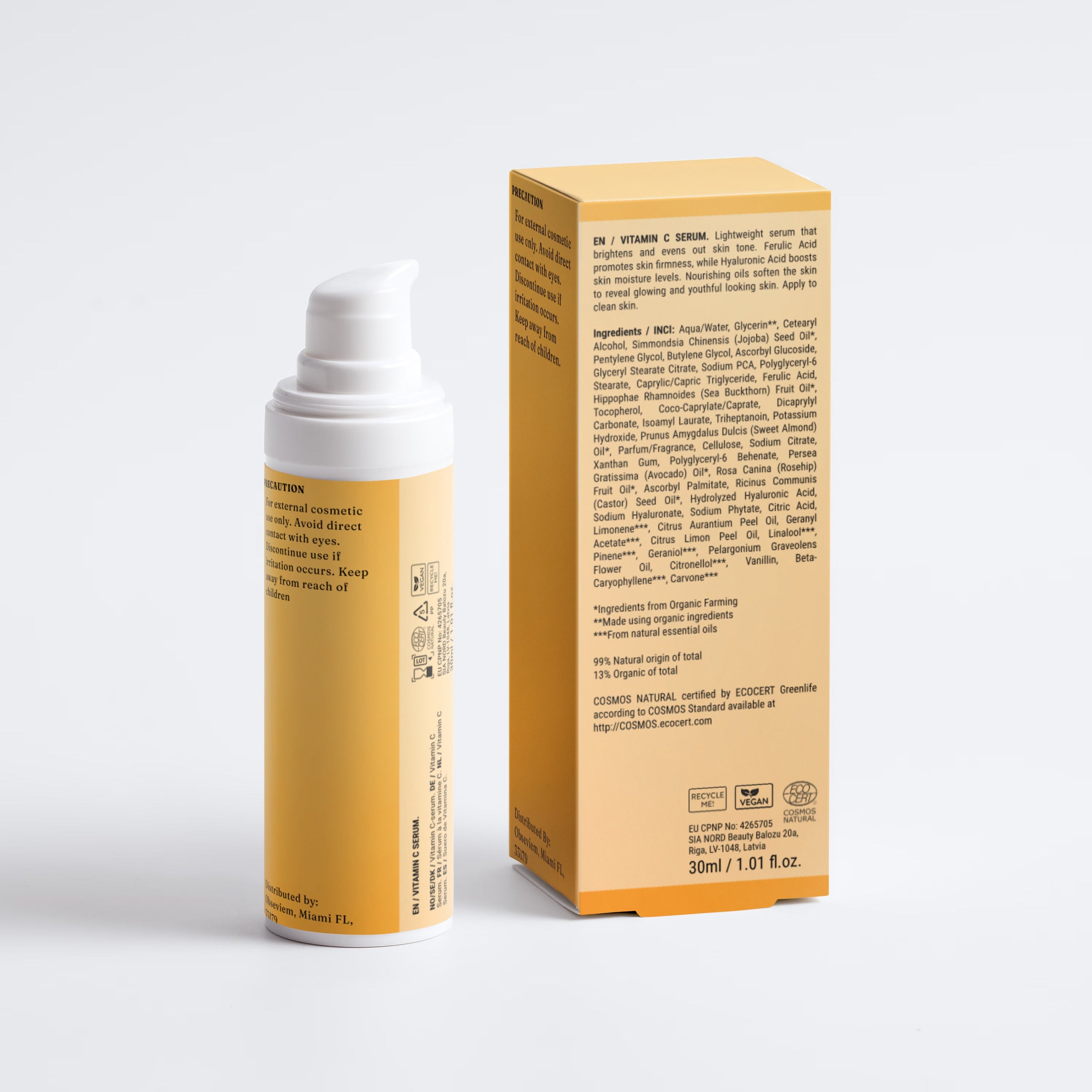 A cosmetic pump bottle and its matching product box, both in a warm golden yellow color with white caps, photographed on a clean light gray studio background.