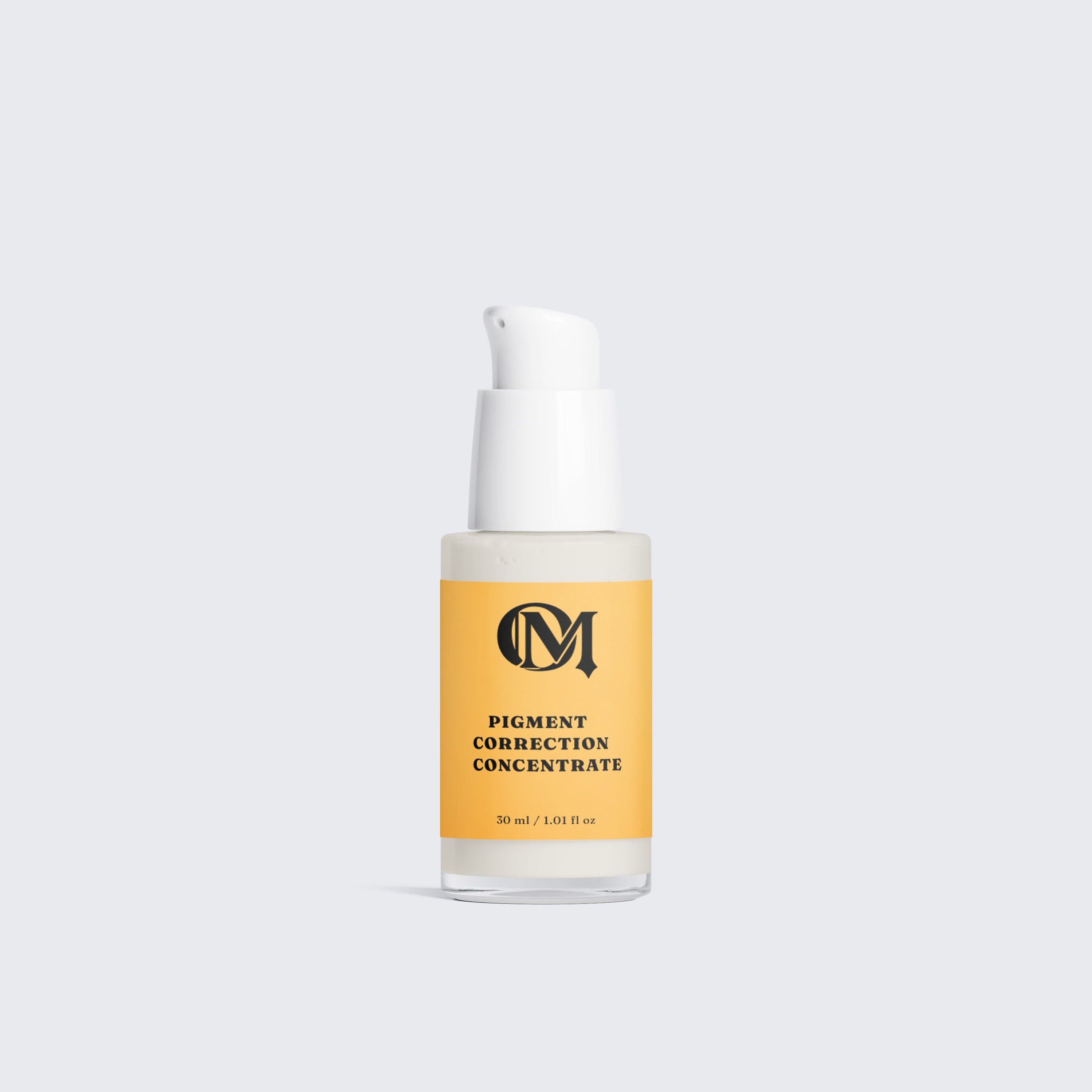A clear pump bottle of pigment correction concentrate with a white pump and a mustard yellow label, centered on a light gray background.