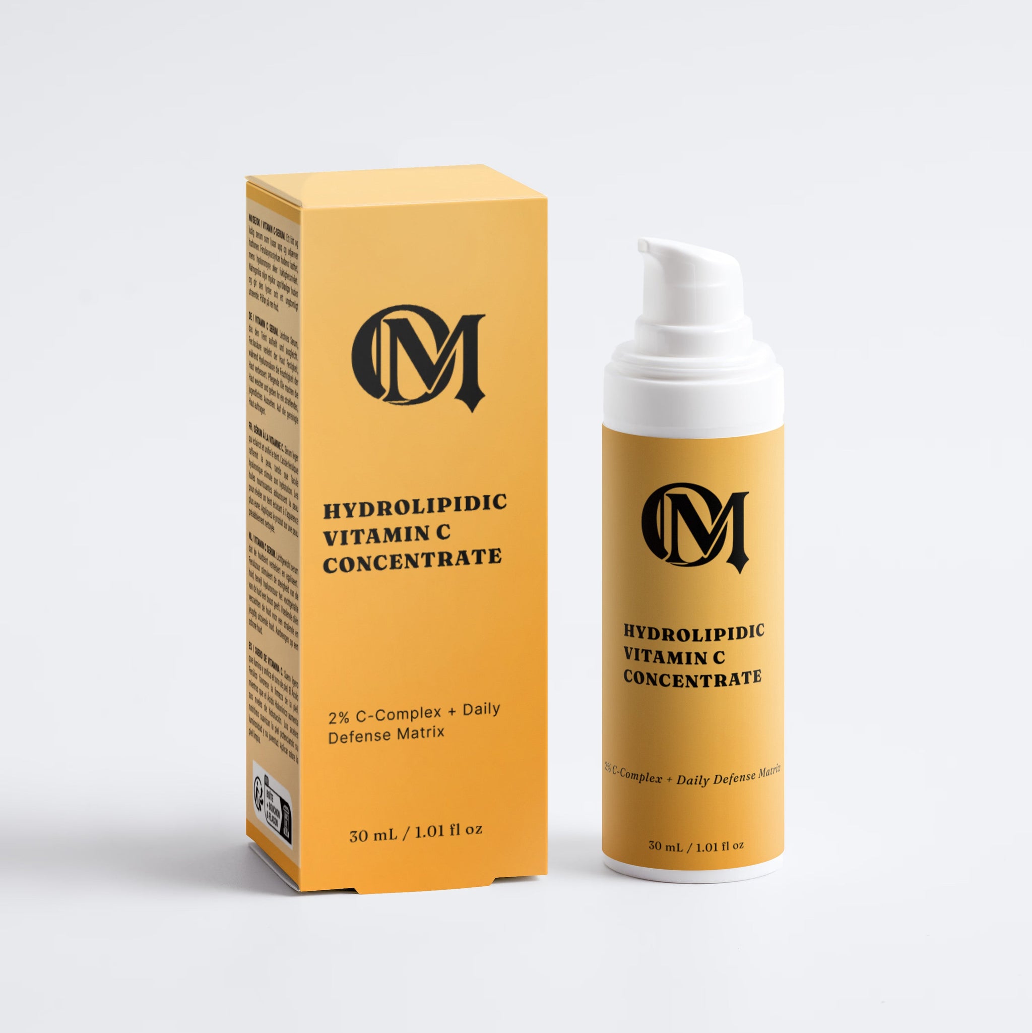 A skincare product set featuring a yellow-orange box and a matching pump bottle of 'Hydrolipidic Vitamin C Concentrate' by the brand 'M', set against a clean white background.